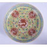 AN EARLY 20TH CENTURY CHINESE FAMILLE ROSE PORCELAIN DISH Guangxu mark and period, painted with drag