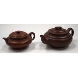 TWO CHINESE YIXING POTTERY TEAPOTS. 10 cm wide. (2)