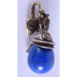 AN UNUSUAL CONTINENTAL SILVER AND LAPIS HELMET PENDANT. 4.5 cm x 2.25 cm.