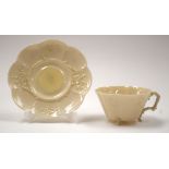 A BELEEK CUP AND SAUCER. (2)