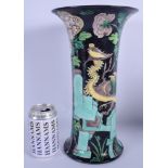 A 19TH CENTURY CHINESE FAMILLE NOIRE PORCELAIN GU SHAPED VASE Kangxi style, painted with birds upon