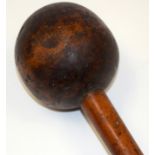 AN ANTIQUE TRIBAL HARDWOOD KNOBKERRIE. 57 cm long.