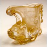 A CHINESE CARVED ROCK CRYSTAL LIBATION CUP. 11 cm wide.