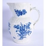 AN 18TH CENTURY WORCESTER MASK HEAD JUG with cabbage leaf moulding, decorated with floral sprays. 23