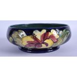 A SMALLER MOORCROFT BOWL decorated with foliage. 14 cm wide.