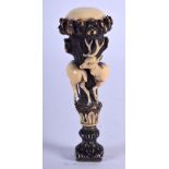 A 19TH CENTURY BAVARIAN BLACK FOREST CARVED IVORY AND HORN SEAL decorated with stags. 9.5 cm high.