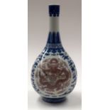 A CHINESE BLUE AND WHITE PORCELAIN DRAGON VASE bearing Qianlong marks to base. 26 cm high.