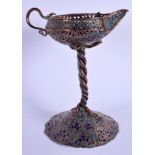 A 19TH CENTURY INDIAN PERSIAN ENAMELLED COPPER CANDLESTICK decorated with foliage. 20 cm high.