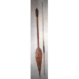 TWO TRIBAL PADDLE SPEARS. 160 cm long. (2)