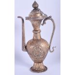 A 19TH CENTURY CHINESE TIBETAN SILVER REPOUSSE EWER AND COVER decorated with foliage. 279 grams. 23