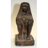 AN ANTIQUE EGYPTIAN STONE FIGURE. 20 cm high.