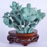 A 19TH CENTURY CHINESE CARVED TURQUOISE FLOWER GROUP Qing, of naturalistic form. Turquoise 10 cm x 8