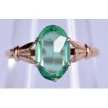 A 9CT GOLD AND EMERALD GLASS RING. 1.7 grams. P.