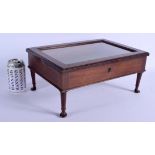 A CHARMING EDWARDIAN MAHOGANY MINIATURE DISPLAY BIJOUTERIE CASE with glass top. 37 cm x 22 cm.