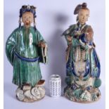 A LARGE PAIR OF 18TH/19TH CENTURY CHINESE GREEN GLAZED FIGURES OF IMMORTALS modelled in blue embelli