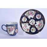 A FINE 18TH CENTURY WORCESTER COFFEE CUP AND SAUCER painted with flowers on a blue fan ground. Sauce