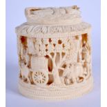 A 19TH CENTURY ANGLO INDIAN CARVED IVORY BOX AND COVER formed with figures on carts amongst trees. 1