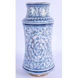 A MIDDLE EASTERN ISLAMIC TURKISH ALBARELLO FAIENCE IZNIK JAR painted with flowers. 24 cm high.