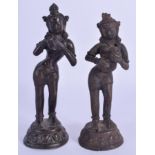 A PAIR OF 19TH CENTURY INDIAN BRONZE FIGURES OF MUSICIANS modelled as buddhistic deity. 16 cm & 14 c