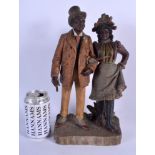 A RARE 19TH CENTURY COLD PAINTED AUSTRIAN TERRACOTTA FIGURE OF A MALE AND FEMALE modelled upon a rec