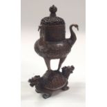 A CHINESE BRONZE CENSER AND COVER. 20 cm high.