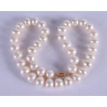A 9CT GOLD PEARL NECKLACE. 38 cm long.