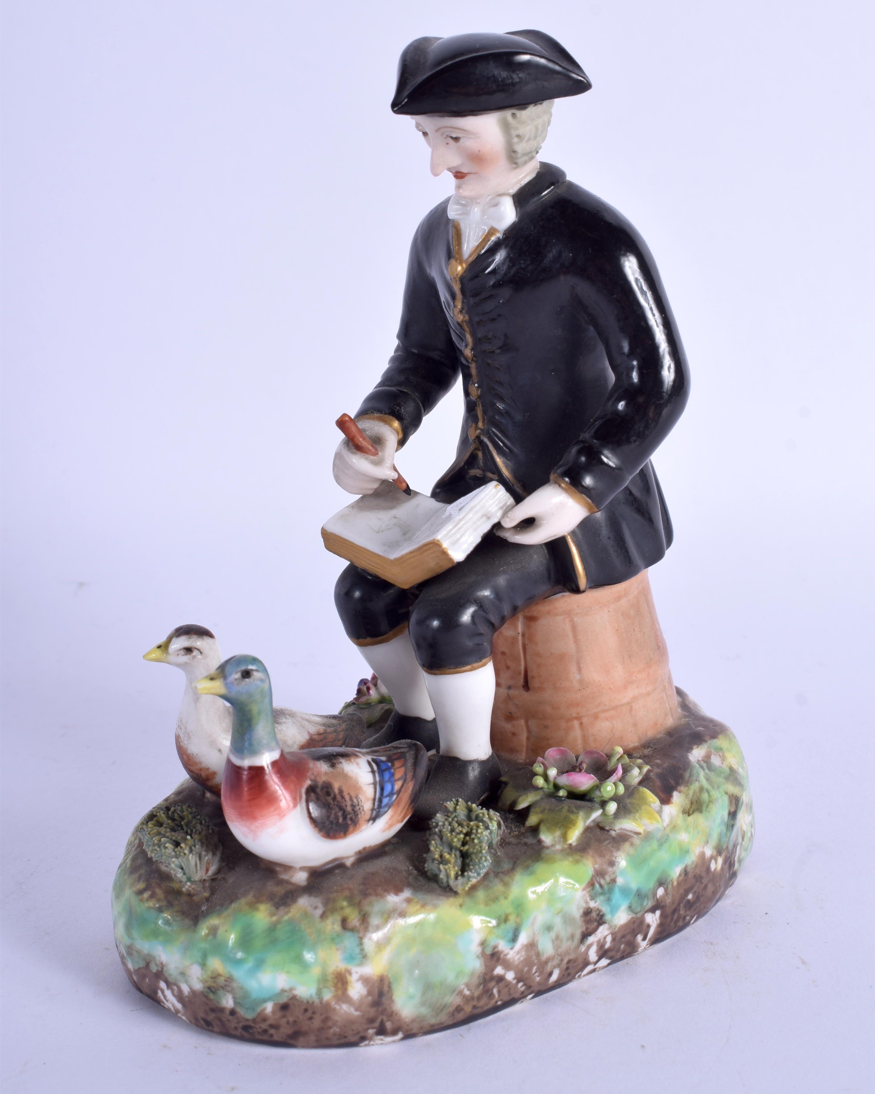 A 19TH CENTURY DERBY FIGURE OF DR SYNTAX modelled sketching. 14 cm x 9 cm.