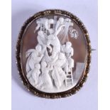 A MID 19TH CENTURY CARVED RELIGIOUS CAMEO BROOCH depicting Christ raised upon the crucifix. 6.5 cm x