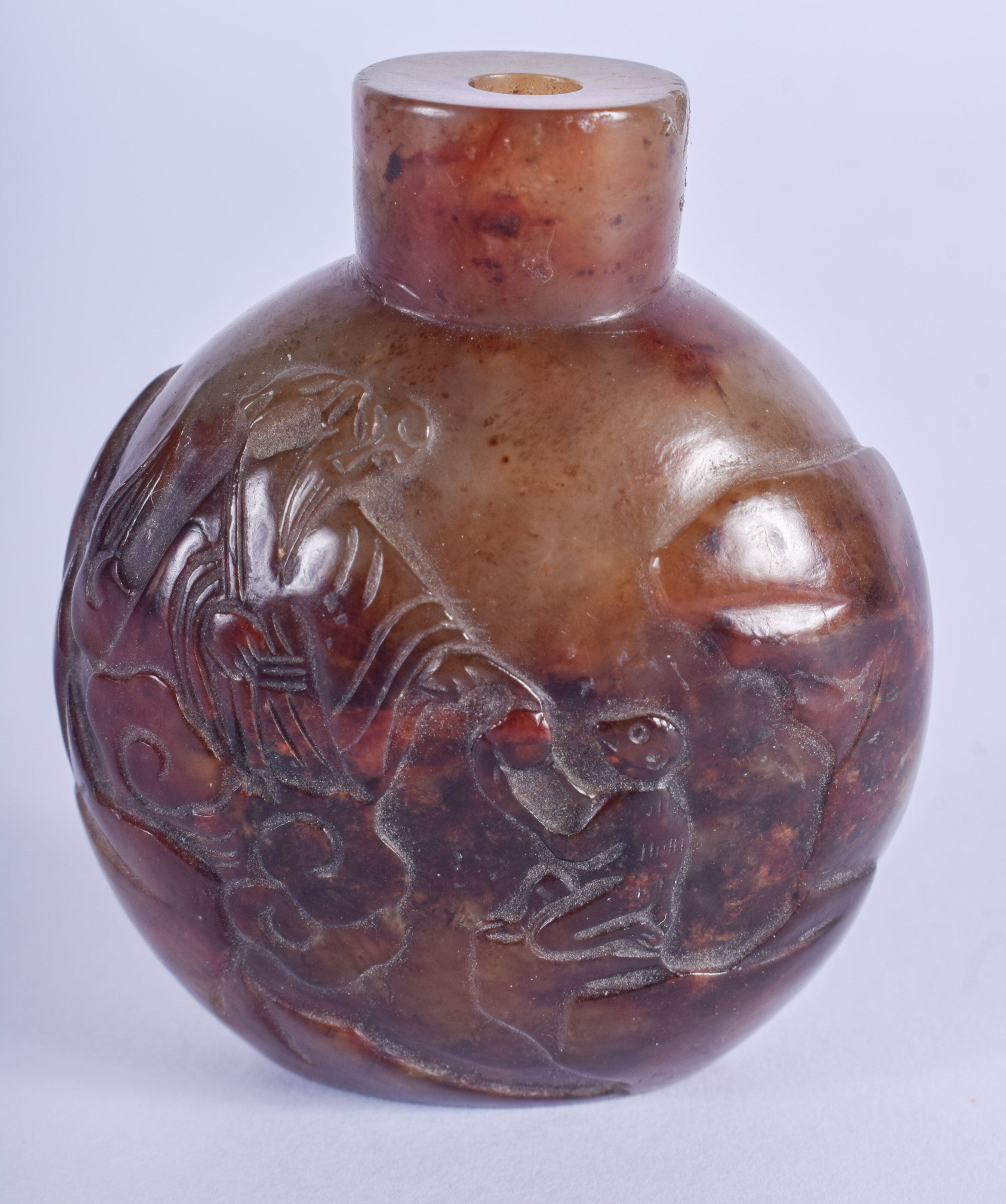 A 19TH CENTURY CHINESE CARVED RUSSET JADE SNUFF BOTTLE Qing. 5.75 cm x 4.5 cm.