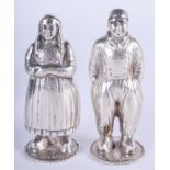 A PAIR OF ANTIQUE DUTCH SILVER BOY AND GIRL CONDIMENTS. 90 grams. 9 cm high.