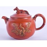 A CHINESE YIXING POTTERY TEAPOT AND COVER formed with a recumbent animal. 13 cm wide.