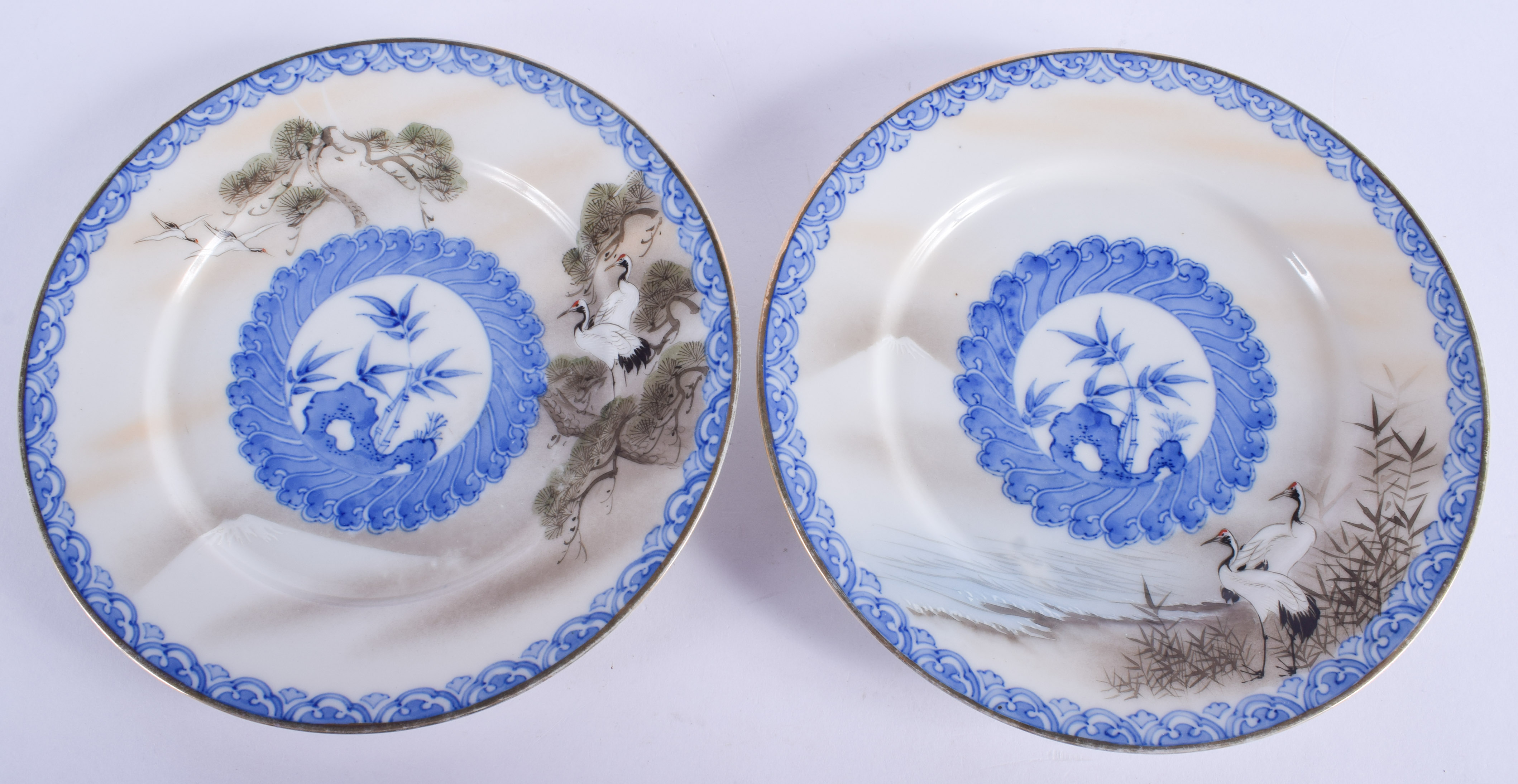 A PAIR OF EARLY 20TH CENTURY JAPANESE MEIJI PERIOD KUTANI PLATES painted with cranes. 18.5 cm wide.