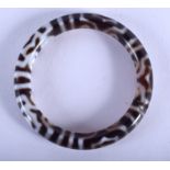 A CHINESE TIBETAN AGATE ZHU BANGLE. 8 cm wide.