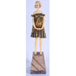 AN ART DECO STYLE IVORINE AND MARBLE FIGURE OF A FEMALE. 38 cm high.