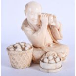 A FINE 19TH CENTURY JAPANESE MEIJI PERIOD CARVED IVORY OKIMONO modelled as an egg inspector. 9 cm x