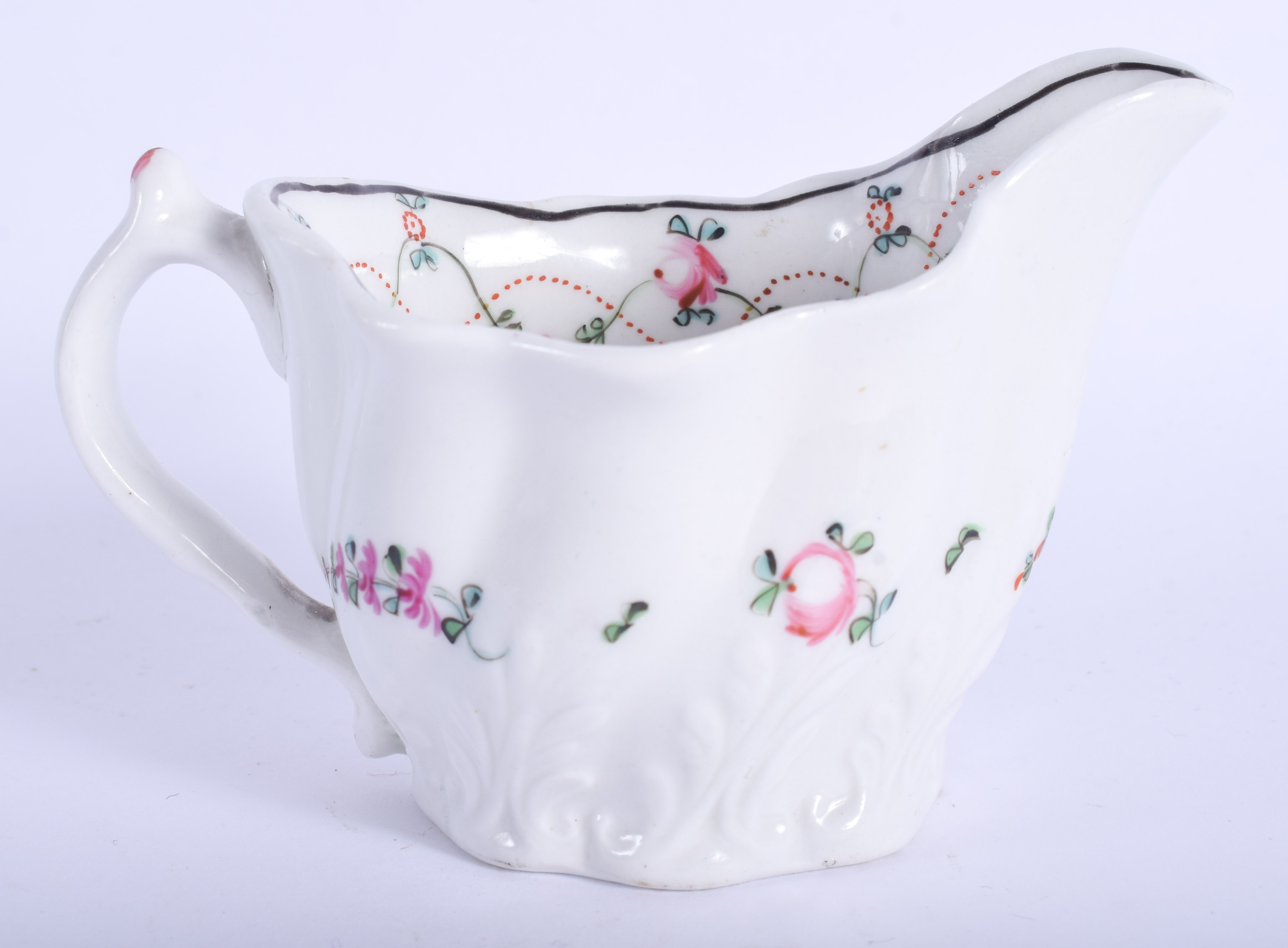 18th c. Caughley Coalport low Chelsea ewer painted with coloured flowers. 11cm wide - Image 2 of 3