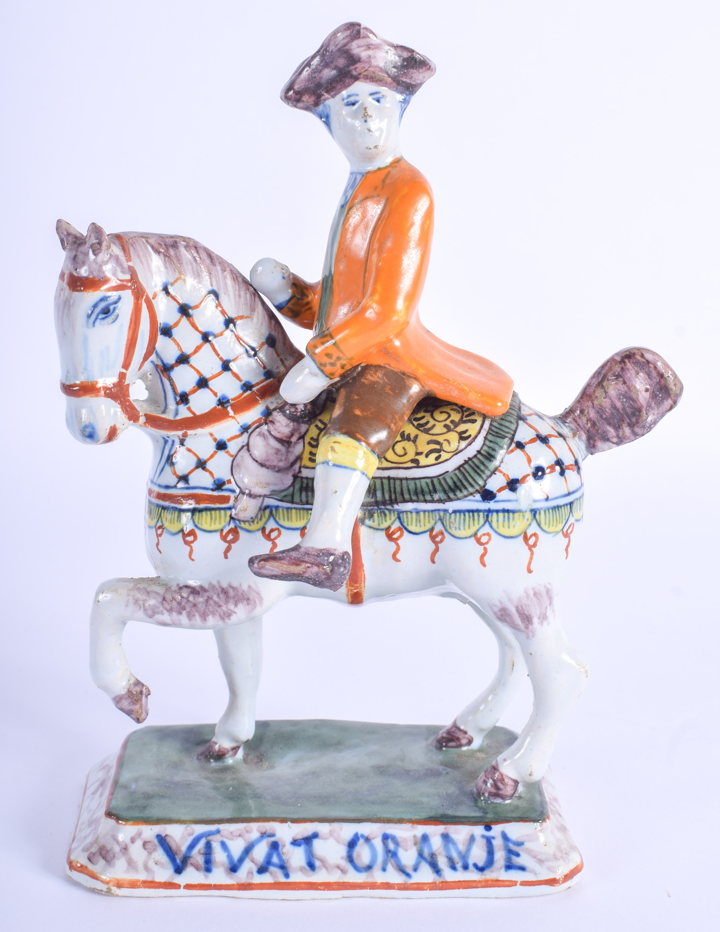 A RARE 18TH/19TH CENTURY DUTCH DELFT FIGURE OF A MALE ON HORSEBACK Vivat Oranje. 11 cm x 16 cm.