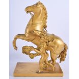 AN EARLY 19TH CENTURY FRENCH EMPIRE ORMOLU FIGURE OF A REARING HORSE modelled beside a putti. 28 cm