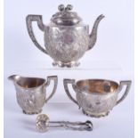 A 19TH CENTURY CHINESE WANG HING FOUR PIECE SILVER TEASET decorated with birds in flight amongst fol