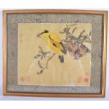 A 19TH CENTURY CHINESE SILKWORK WATERCOLOUR PANEL depicting a bird amongst fruit. 32 cm x 27 cm.