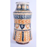 A MIDDLE EASTERN TURKISH POTTERY ALBARELLO painted with motifs. 19 cm high.