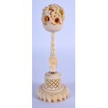 A 19TH CENTURY CHINESE CANTON IVORY PUZZLE BALL. 11 cm high.