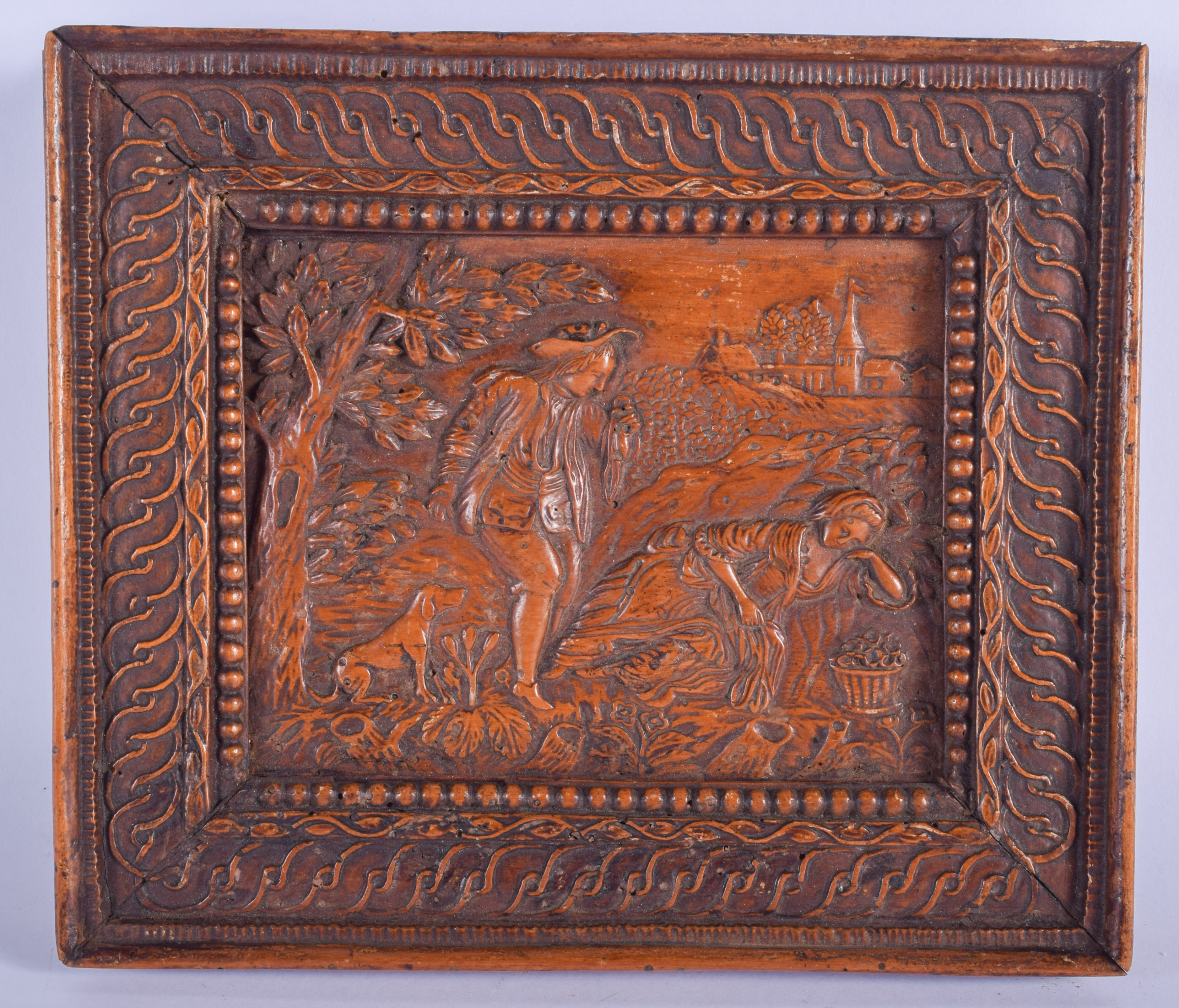 AN 18TH CENTURY CONTINENTAL FRUITWOOD PLAQUE C1750 depicting a romantic country landscape scene. 20