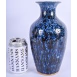 A 19TH CENTURY CHINESE FLAMBE GLAZED VASE Qing, with mottled blue drip glaze. 24.5 cm high.