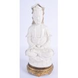 AN EARLY 20TH CENTURY CHINESE BLANC DE CHINE FIGURE OF GUANYIN upon a gilt metal base. Figure 26 cm