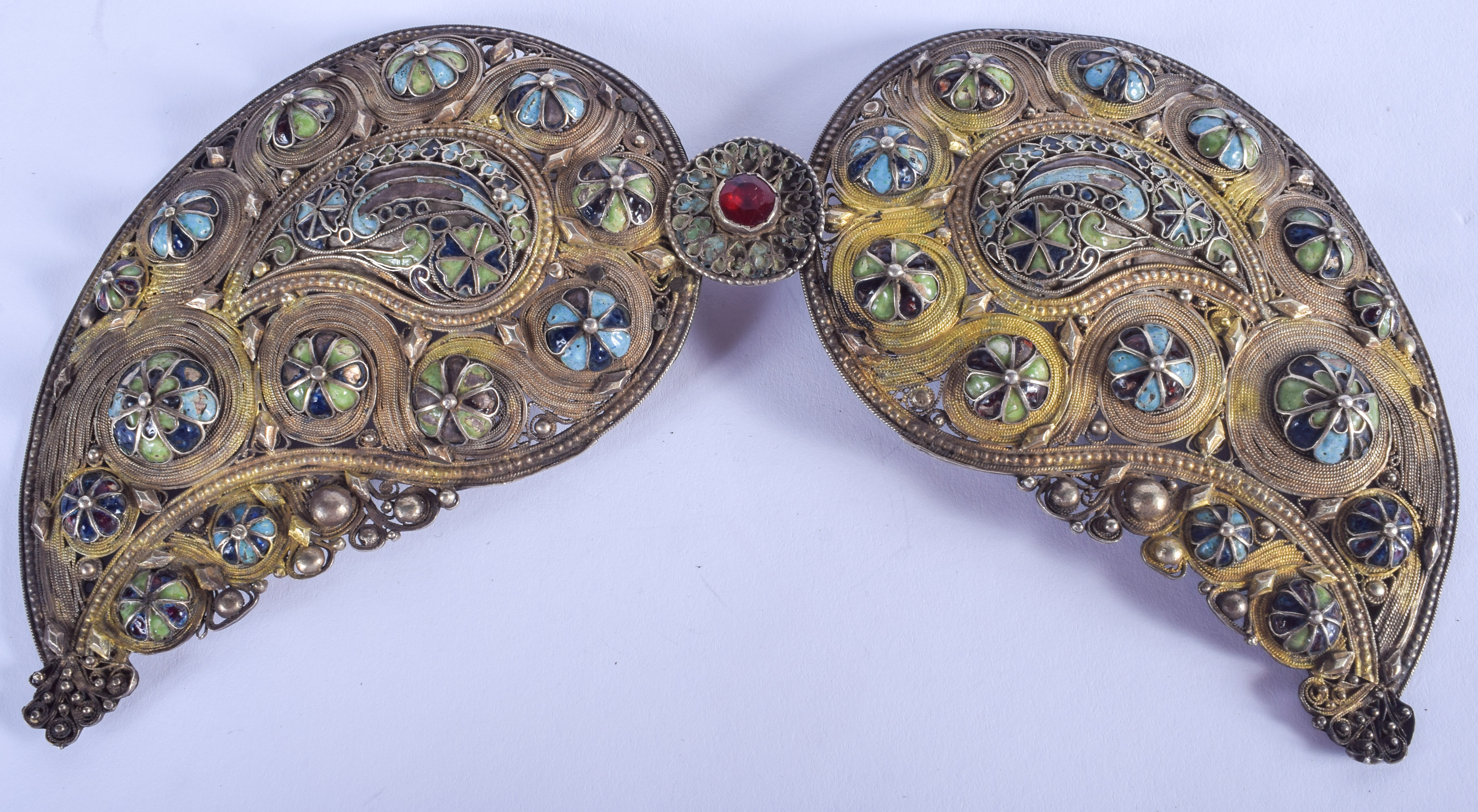 A RARE 19TH CENTURY MIDDLE EASTER SILVER ENAMEL AND RUBY BUCKLE decorated with foliage. 227 grams.