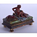 A COLD PAINTED BRONZE FIGURE OF A MONKEY modelled upon a rectangular base. 9 cm wide.