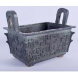 A 1930S CHINESE TWIN HANDLED BRONZE CENSER of archaic form, decorated with mask heads. 21 cm x 15 cm