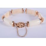 A 1920S CHINESE 14CT GOLD AND IVORY BRACELET. 13 cm long.