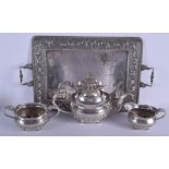 A LOVELY 19TH CENTURY INDIAN BOMBAY SCHOOL SILVER TEASET ON TRAY decorated with elephants and other